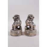 A pair of Chinese filled white metal fo dogs, 4 character mark to base, 4½" high