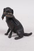 A cold painted bronze figure of a labrador gun dog with pheasant in its mouth, 3½" high