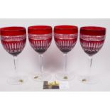 A set of four Waterford Crystal flash cut ruby and clear wine glasses, 9" high