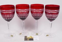 A set of four Waterford Crystal flash cut ruby and clear wine glasses, 9" high