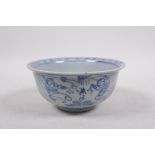 A blue and white porcelain rice bowl, decorated with boys playing in a landscape, 5½" diameter