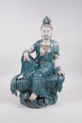 A Chinese teal and white glazed porcelain Quan Yin, impressed seal marks verso, 16½" high