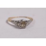 An 18ct yellow gold and platinum ring set with a champagne diamond, approximate size 'M'