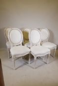 A set of fine French style carved and painted spoon back chairs, raised on fluted supports