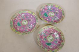 Three graduated Cantonese ceramic plates with enamelled decoration, four character marks to base,