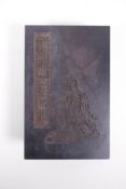 A Chinese wood and silk bound book containing spinach jade tablets with engraved and gilt