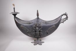 A late C19th architectural gas lamp fitting in the form of an oil lamp, decorated with putti and