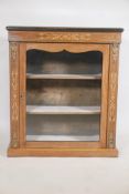 A Victorian inlaid rosewood single door pier cabinet, with ebonised edge top and brass mounts, raise