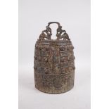 A Chinese bronze bell with raised archaistic decoration, 11" high