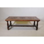 An Argentinian oak coffee table with embossed leather top, 17½"  x 48" x 20"