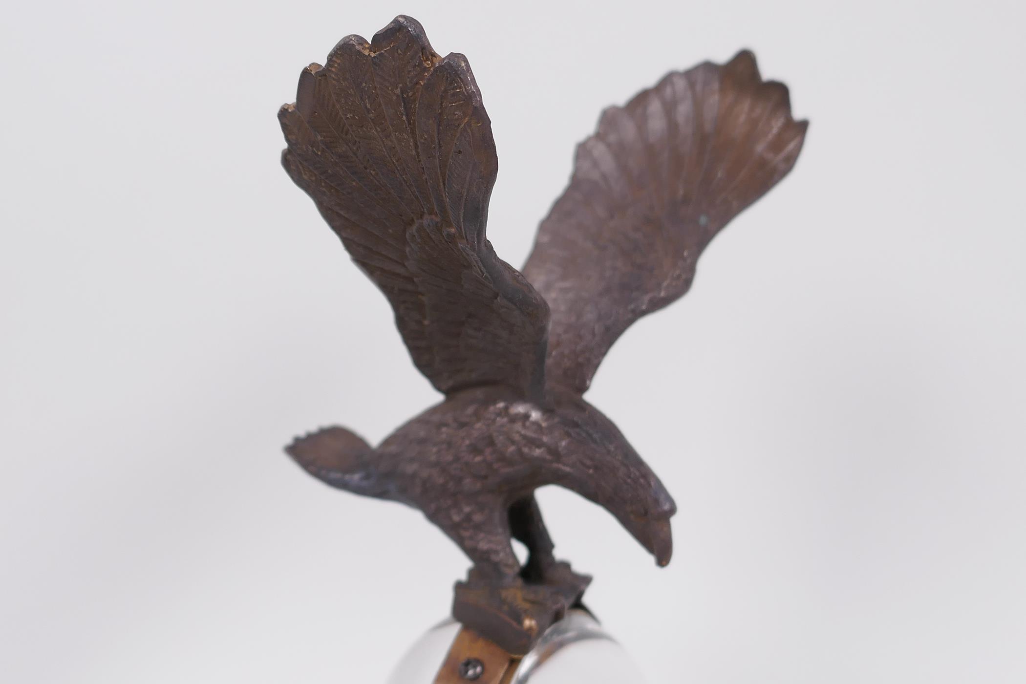 An unusual desk top ball clock, the base with two cast figures of rabbits, the clock surmounted with - Image 4 of 5