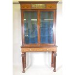 A C19th mahogany two section mahogany display cabinet, with satinwood banded inlay and painted