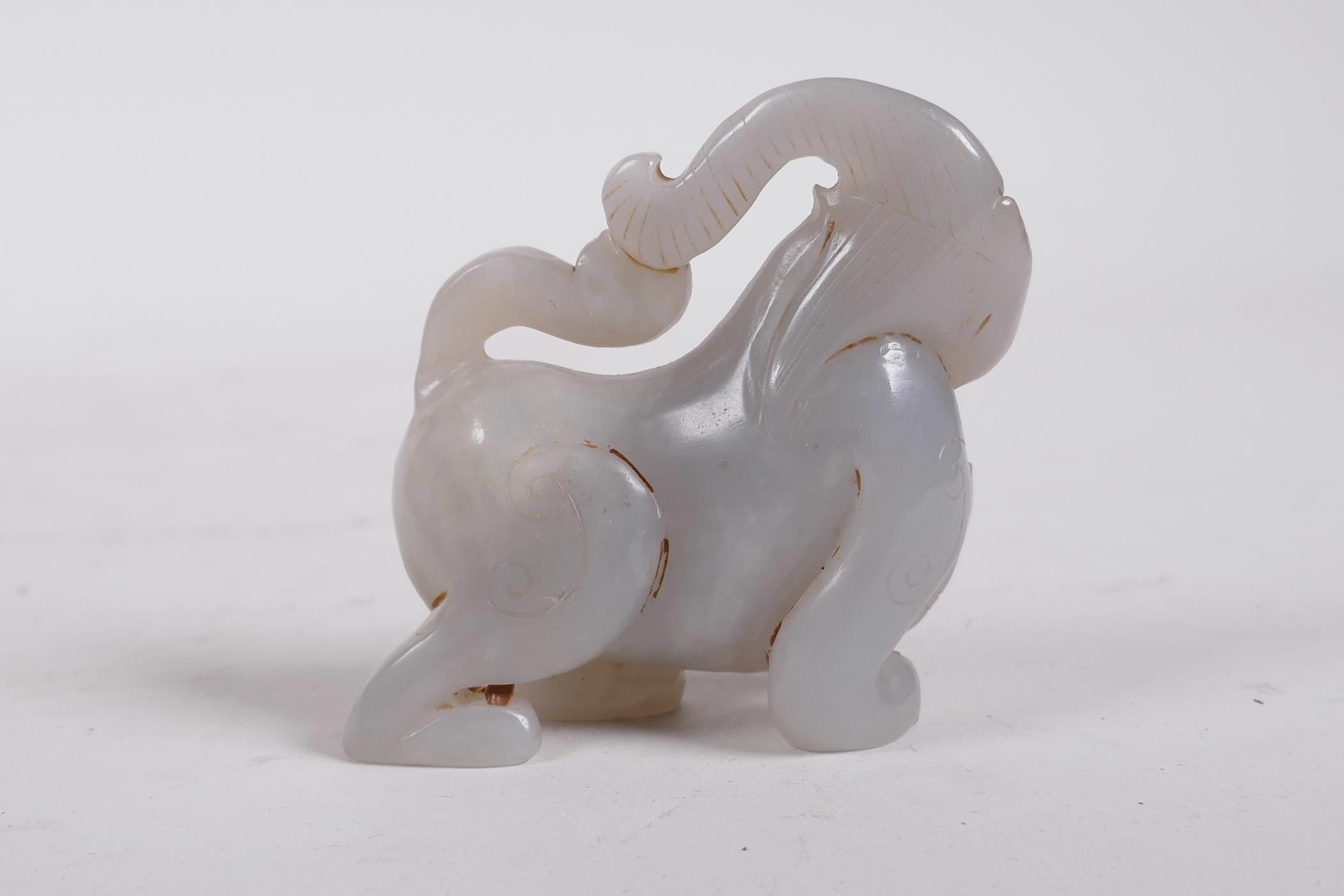 A Chinese carved celadon jade monkey, 3" long - Image 2 of 3