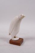 A carved marine ivory penguin, 5½" high