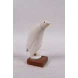 A carved marine ivory penguin, 5½" high