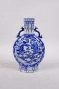 A Chinese blue and white porcelain two handled vase of slender form, decorated with a phoenix and