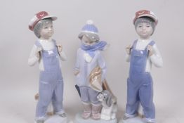 Three Lladro figures of young boys, one with puppy, 8½" high