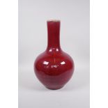 A Chinese sang de boeuf glazed pear shaped vase, 6 character mark to base, 13½"