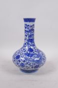 A blue and white porcelain vase decorated with dragons and flowers, seal mark to base, 8" high,