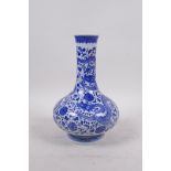 A blue and white porcelain vase decorated with dragons and flowers, seal mark to base, 8" high,