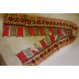 A Gujarati hand embroidered toran hanging, mid C20th, 172" long