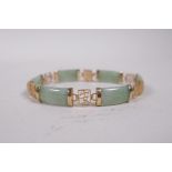 A 9ct yellow gold and green jade bracelet, the links decorated with Chinese characters, 7" long