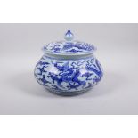 A Chinese Ming style blue and white porcelain jar and cover of squat form with dragon and phoenix