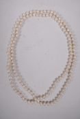 A long string of Mikimoto pearls, recently restrung, in an original Mikimoto silk case, 38" long