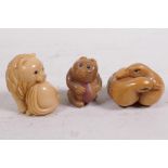 Three carved tagua nut netsuke carved as carved as a lion, bear and two ducks, 1½" long