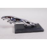A chromium plated replica Jaguar car mascot mounted on a marble base, 7½" long