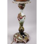 An Austrian Amphora lamp base moulded with a leaf design in the Art Nouveau style, painted in bright