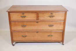 A late C19th elm chest of two over two drawers, with moulded fronts and brass handles, raised on