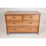 A late C19th elm chest of two over two drawers, with moulded fronts and brass handles, raised on