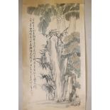 A Chinese watercolour scroll depicting a rocky outcrop with banana palms and flowers, character