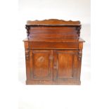 A Victorian mahogany chiffonier, with shaped back and single frieze drawer over two cupboards,