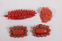 A small collection of antique coral brooches and pendants, largest 2½"