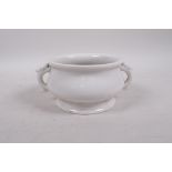 A blanc de chine porcelain censer with two handles, impressed mark to base, 5" diameter