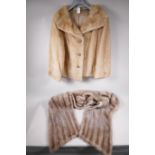 A lady's blonde fur short jacket, approximate size 14, 21" long, together with a silver fur stole,