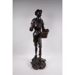 A patinated cast iron figure of Don Quixote, impressed to base, J. Gautier, 29" high