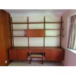 A 1960s Danish modular teak three bay wall unit, probably by Poul Cadovius, with adaptions, each bay