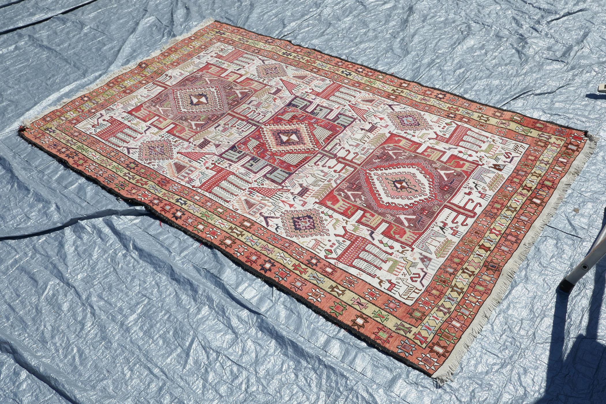 A Persian multicolour ground silk and wool rug decorated with three medallions and geometric - Image 3 of 7