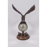 An unusual desk top ball clock, the base with two cast figures of rabbits, the clock surmounted with