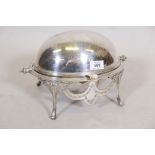 A sliver plated tureen raised on stand with scrolled and reeded decoration, 12" wide x 10" high