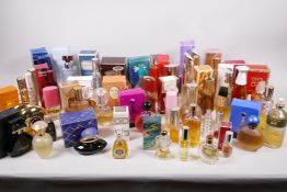 A collection of vintage perfumes, many with original boxes, approximately 50