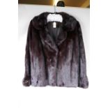 A lady's mink fur jacket from Charles Moss Furs, approximate size 14, 22" long