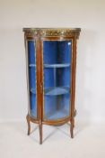A French mahogany and ormolu mounted Louis XV style vitrine, with serpentine front and marble top