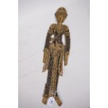 An oriental puppet figure constructed from old Chinese coins, and gilt painted card, 19" long, A/F
