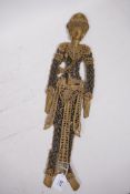 An oriental puppet figure constructed from old Chinese coins, and gilt painted card, 19" long, A/F