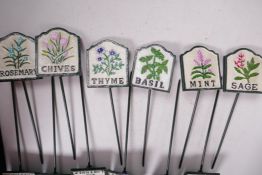 A set of twelve painted cast iron herb markers, 3" x 2¾"