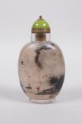 A Chinese reverse decorated glass snuff bottle decorated with travellers in landscape scenes to